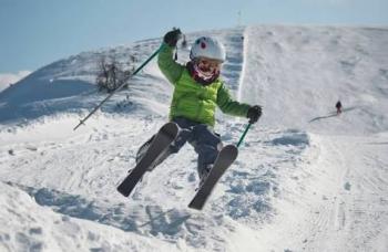 skiing kids enjoy jump