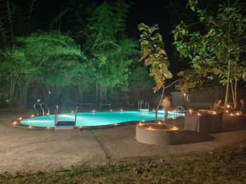 Candle-lit Pool Under the Stars