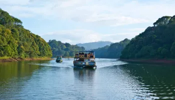 Theni – Thekkady – Suruli Falls – Thenwith: Tempo Traveller Tour (2 Nights / 3 Days)